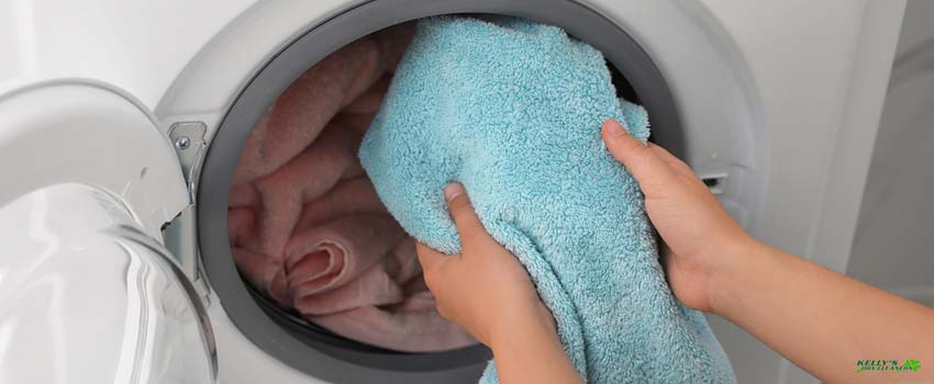 KDC-man putting towel on washing machine